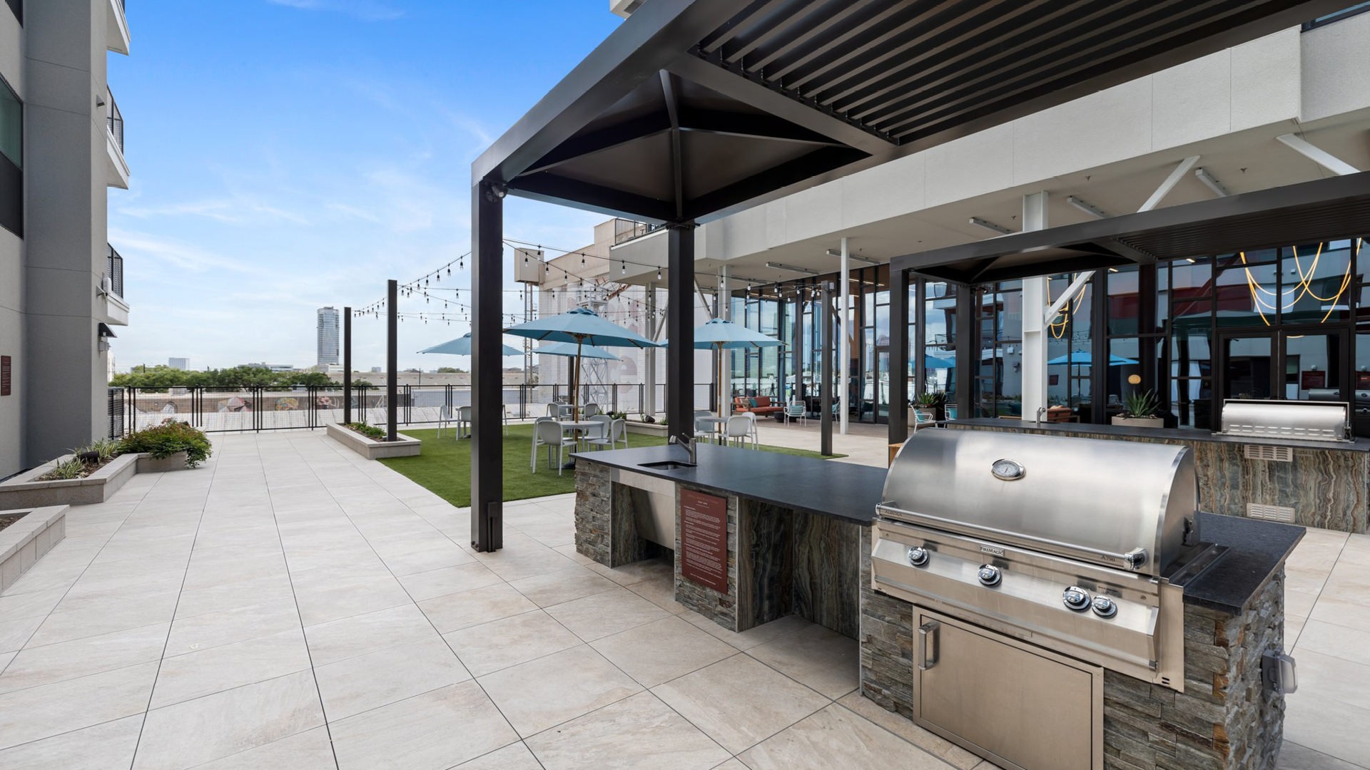 Outdoor Kitchen with grills and outdoor seating