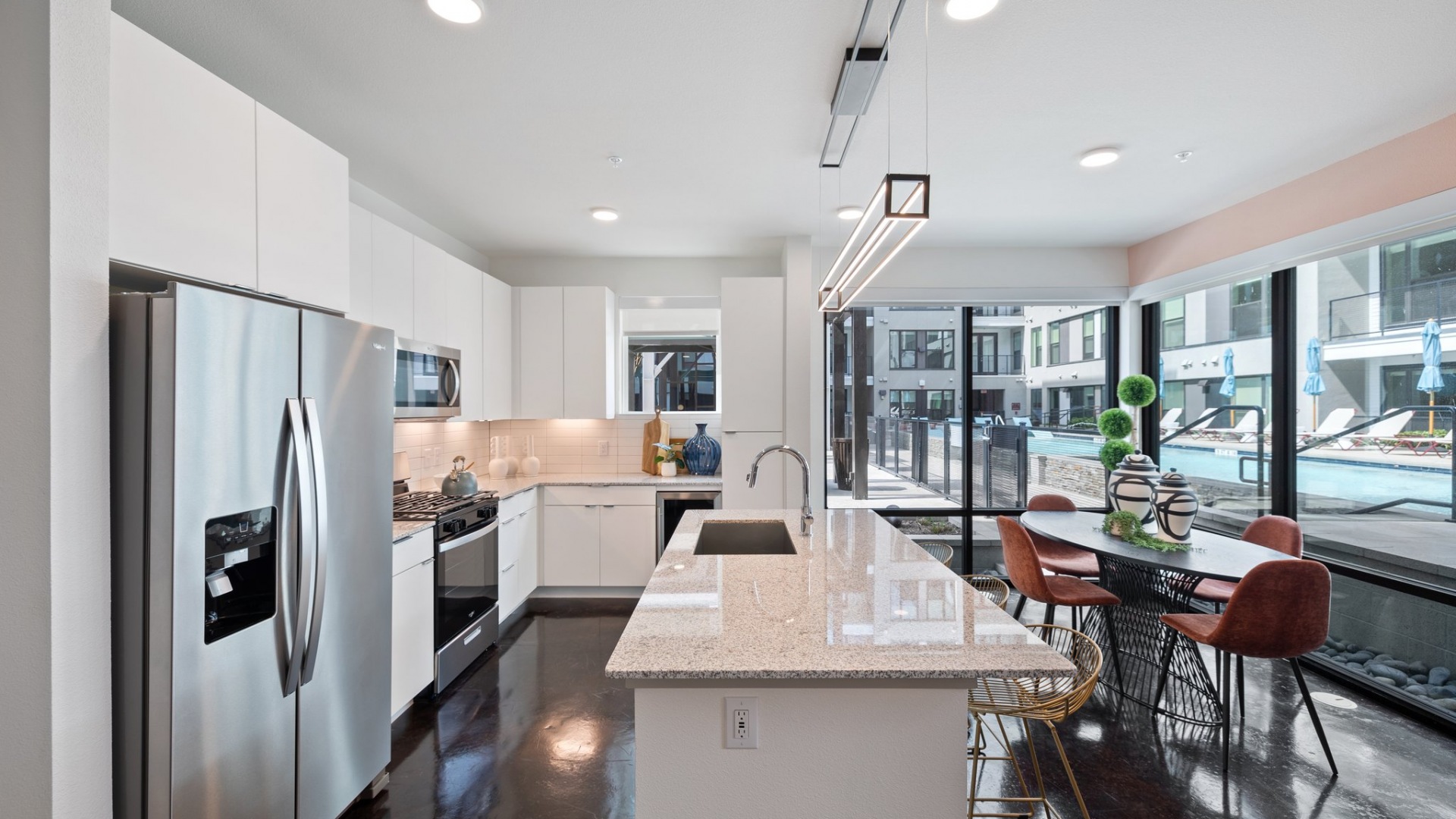Interior Home Kitchen with Stainless Steel Appliances and Dining Room