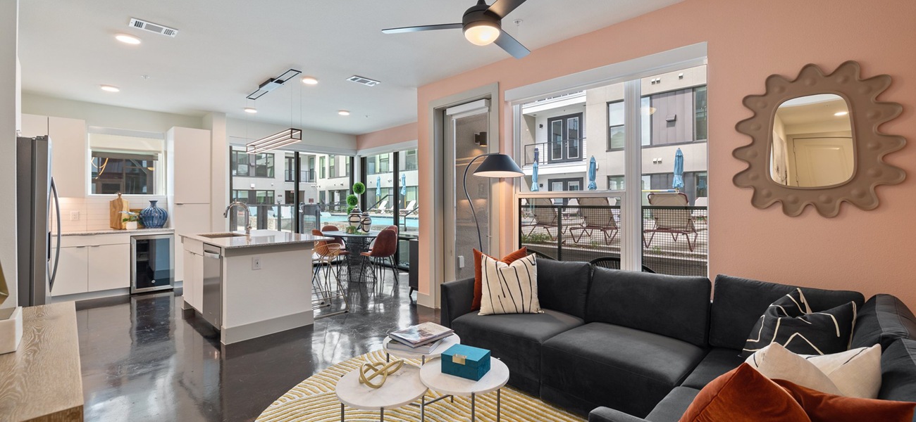 Spacious and well lit living room with large windows 